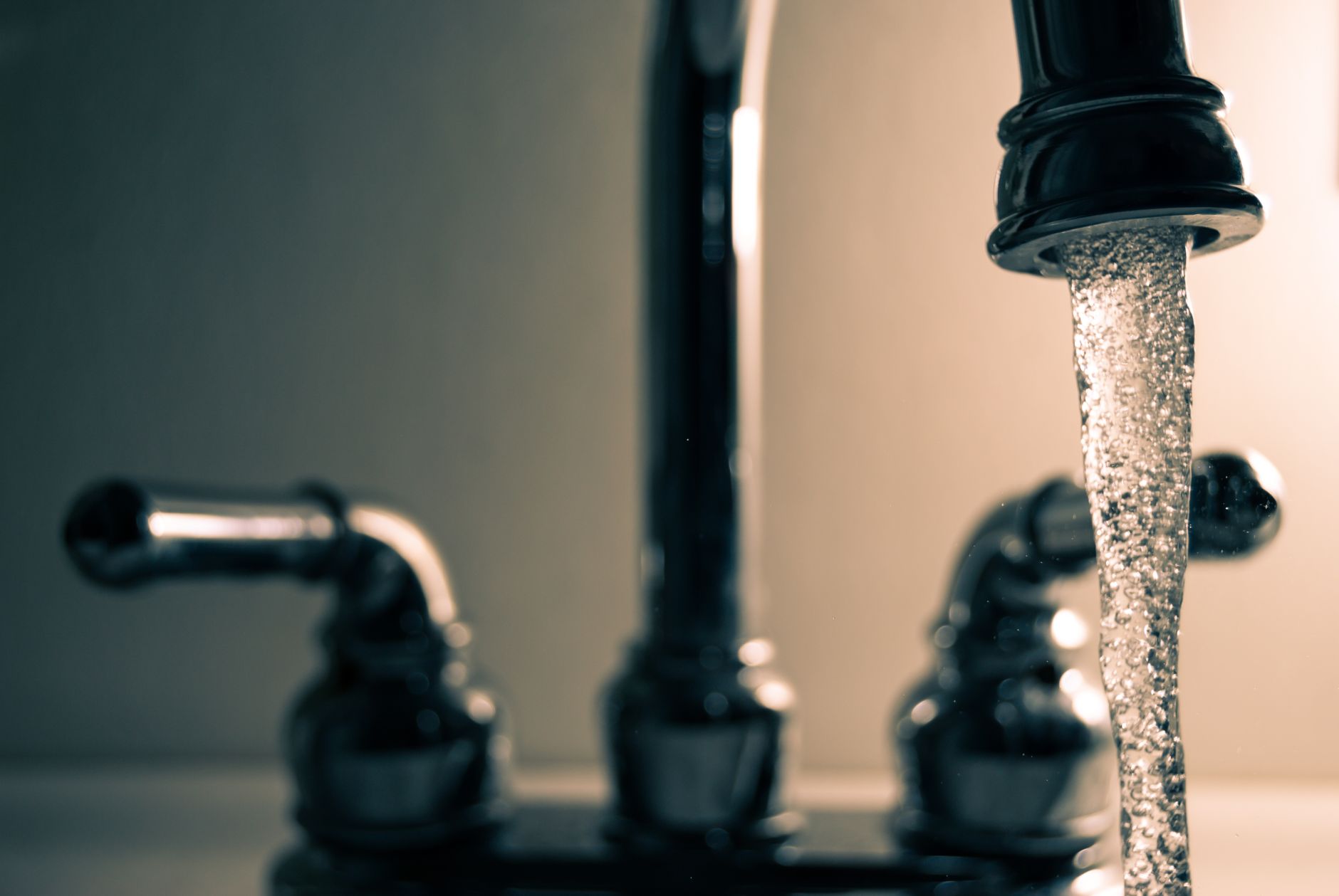 Water running from a kitchen faucet