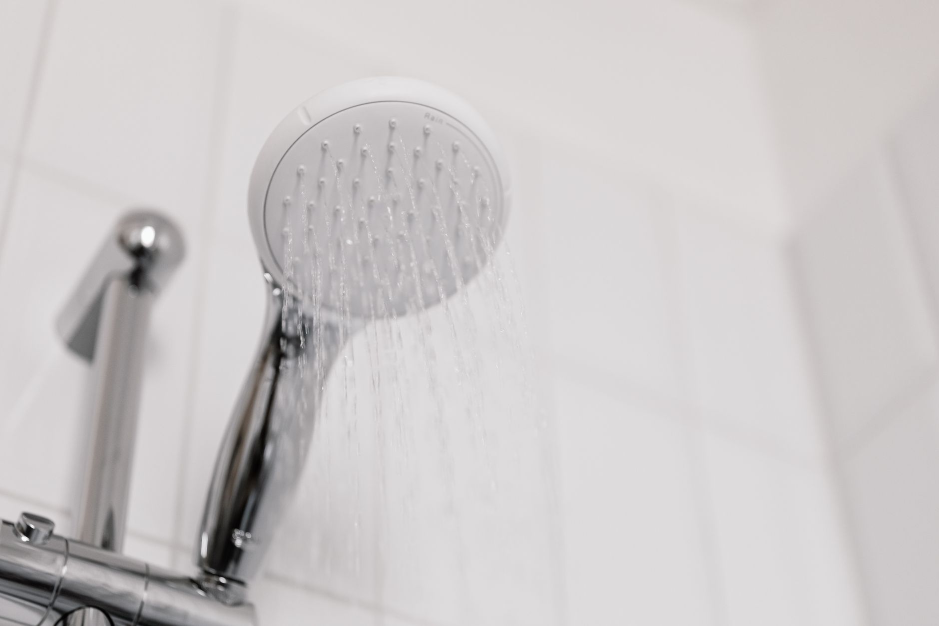 Water flowing from a shower head