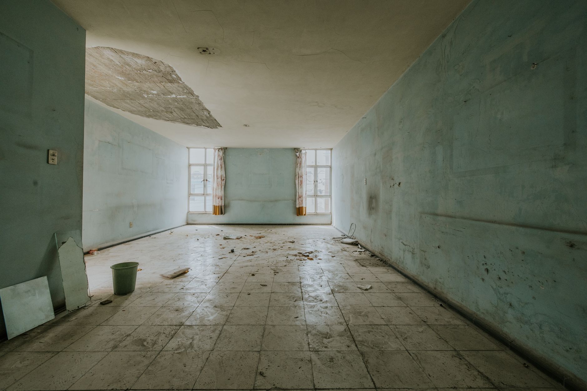 Water-damaged room with a collapsed ceiling