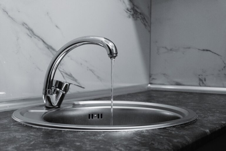 Best water softener: water running from a kitchen faucet