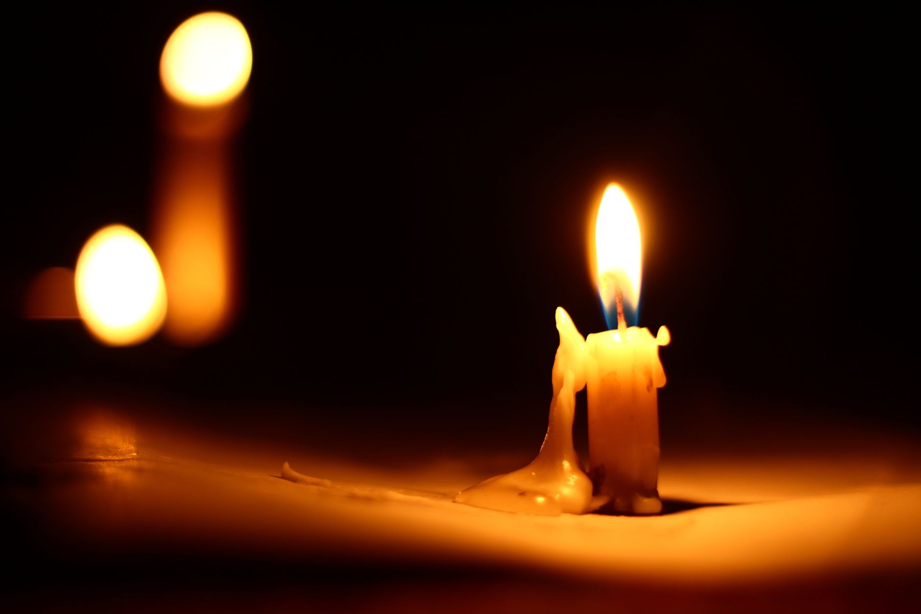 Candles burning in the dark