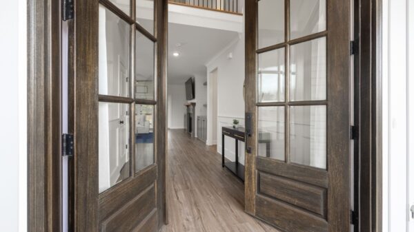 Glass-paneled double doors opening into a hallway