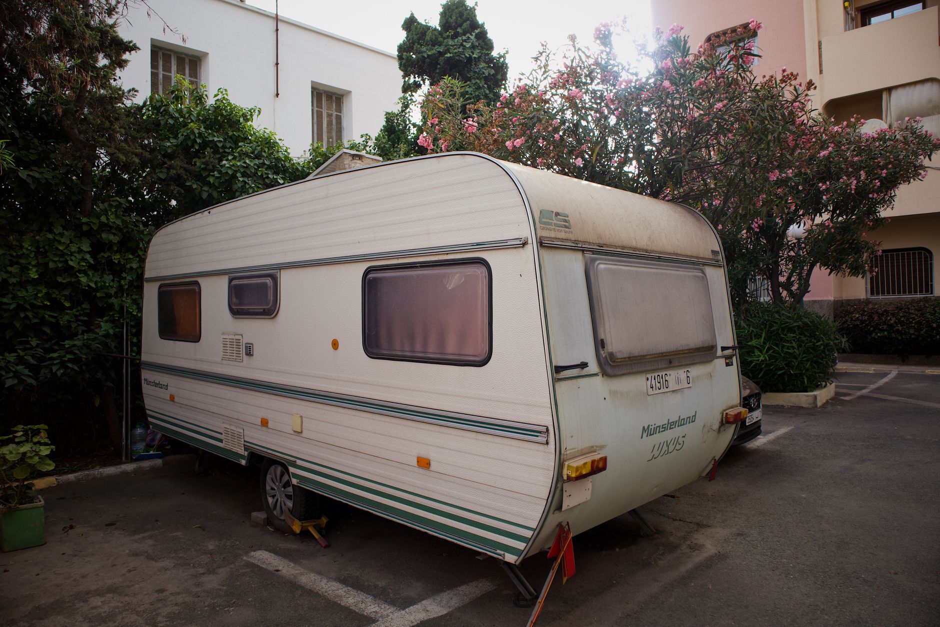 A caravan parked on a paved lot