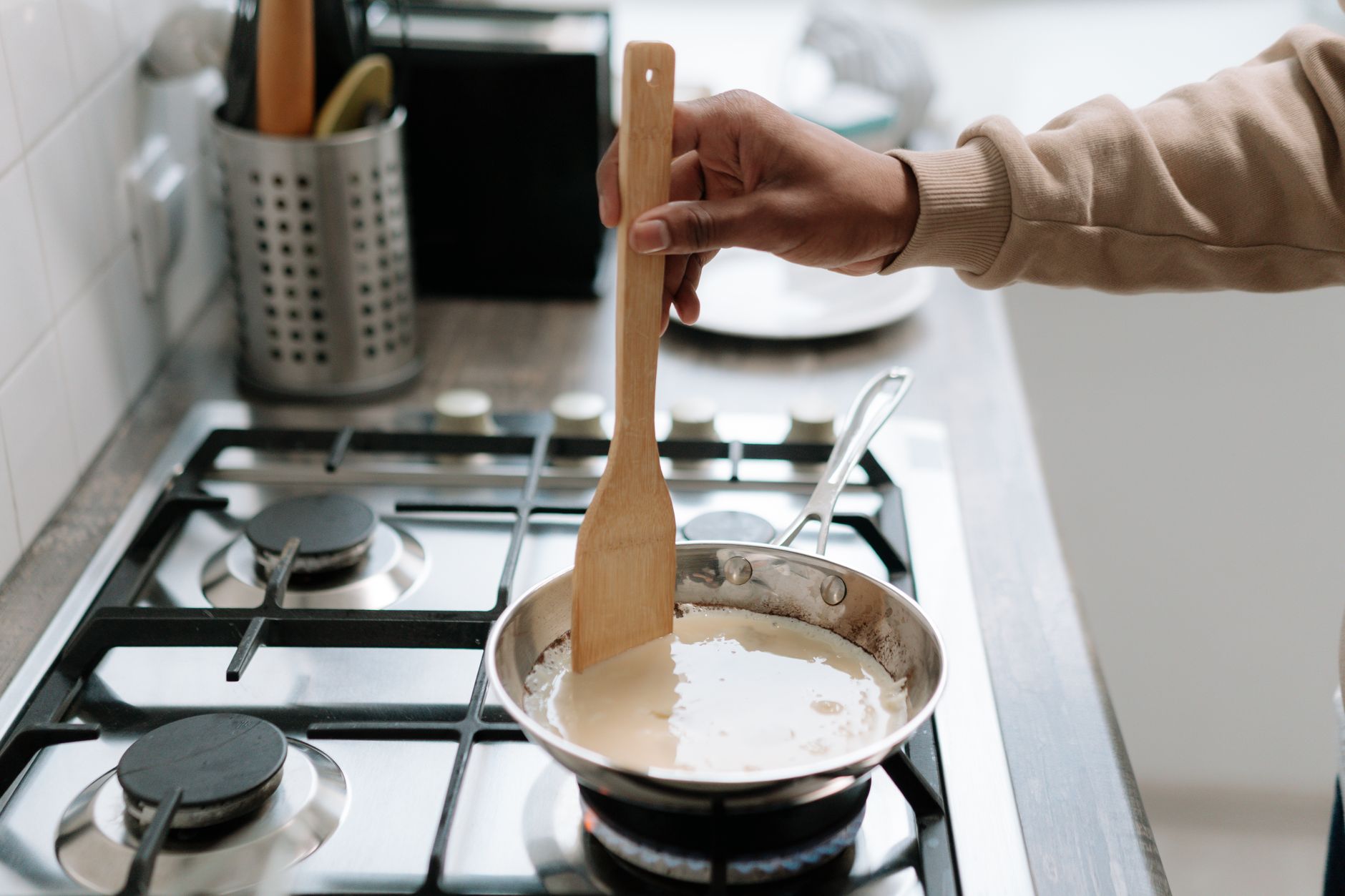 Stirring a sauce in a pan on the stove