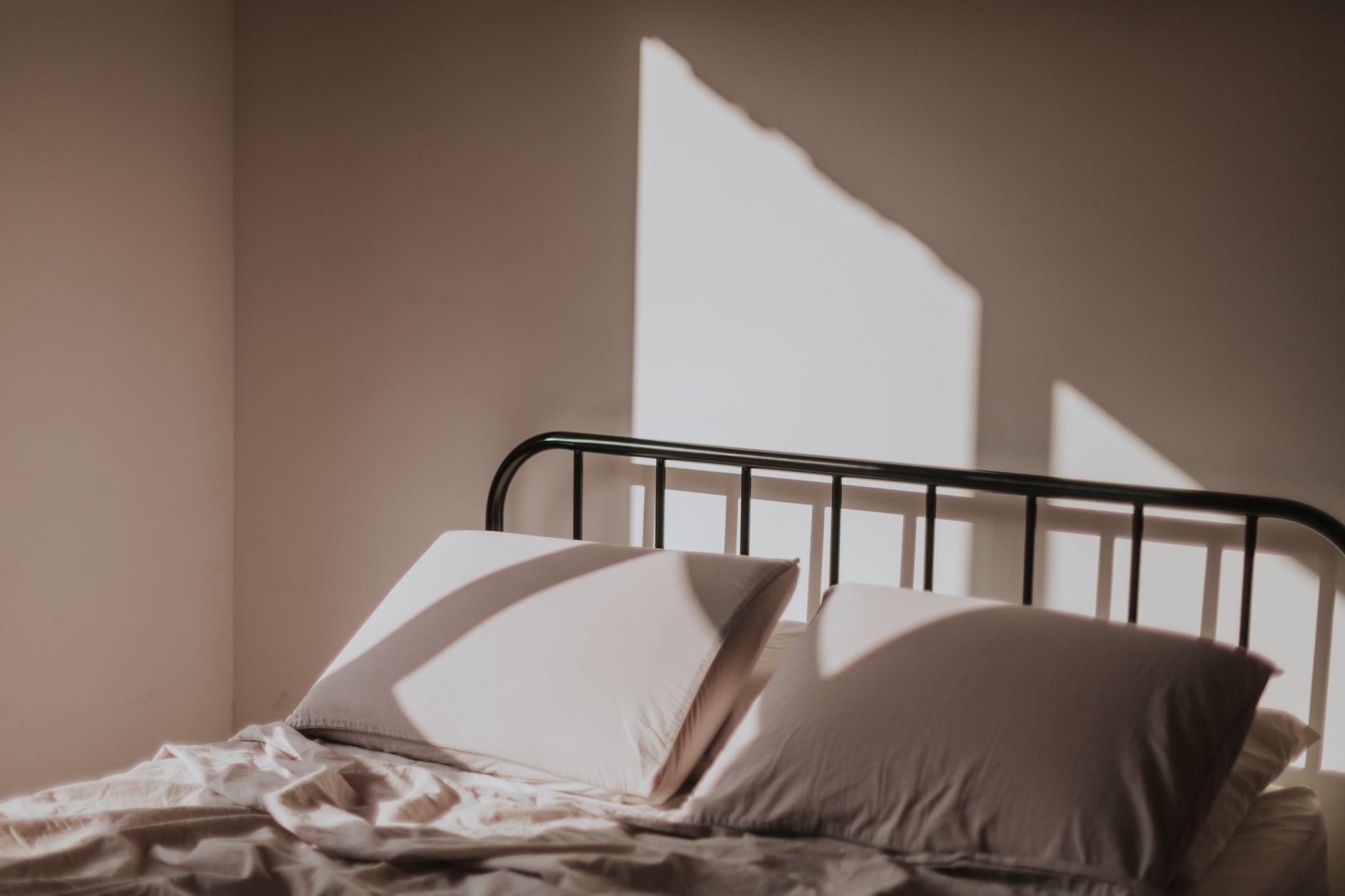 Pillows on a bed with a metal frame