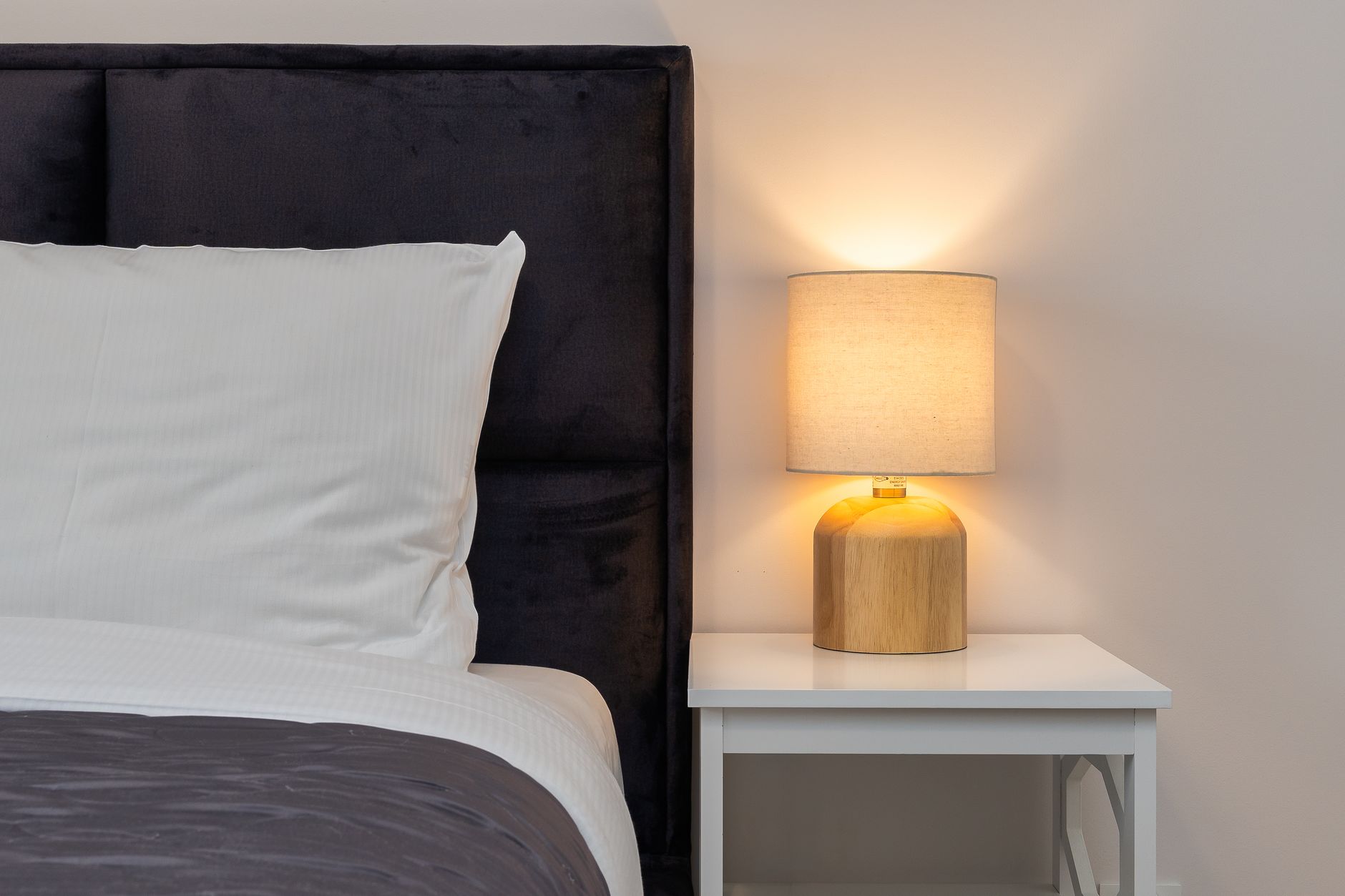 A bedside lamp on a nightstand