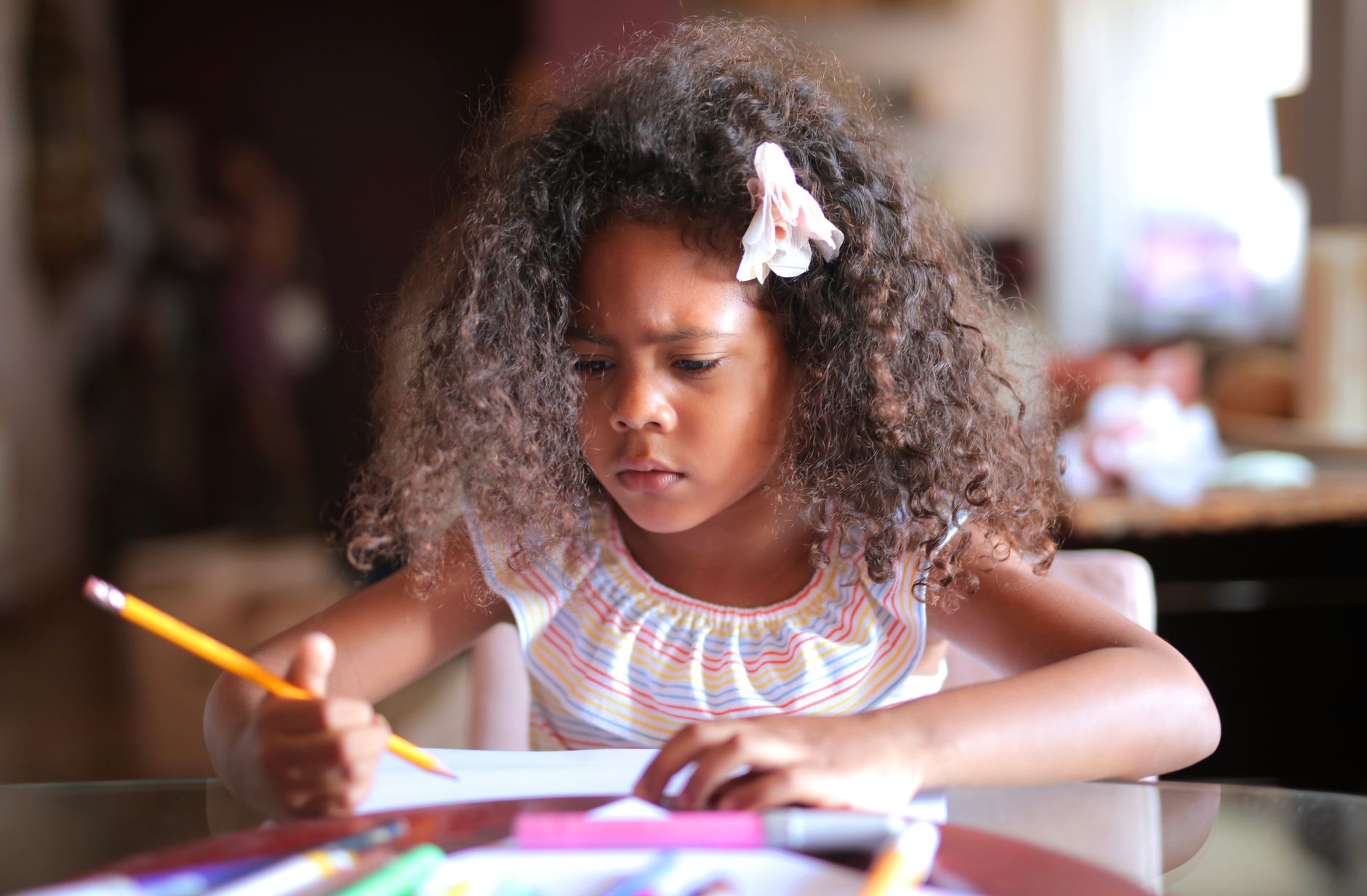 A child doing homework at a table
