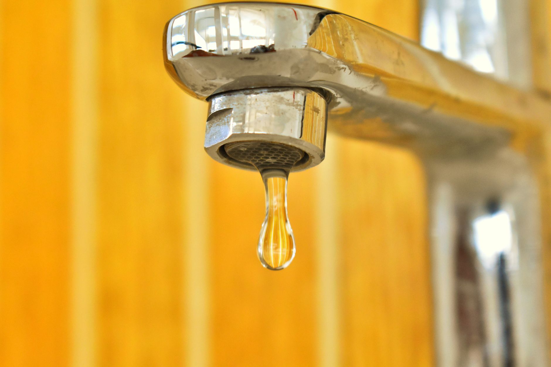 A drip falling from a faucet