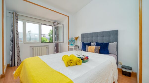 A bright bedroom with open windows