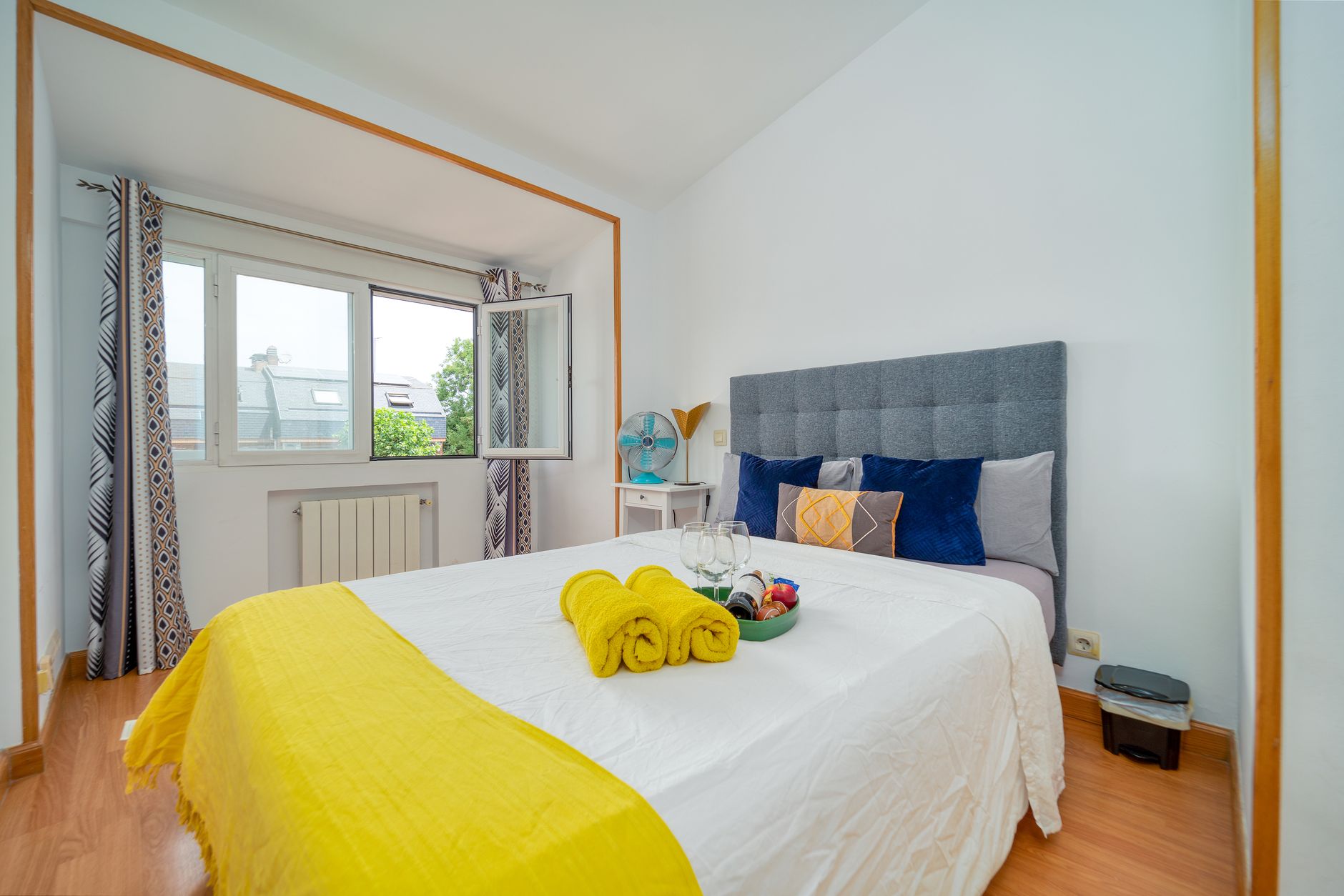 A bright bedroom with open windows