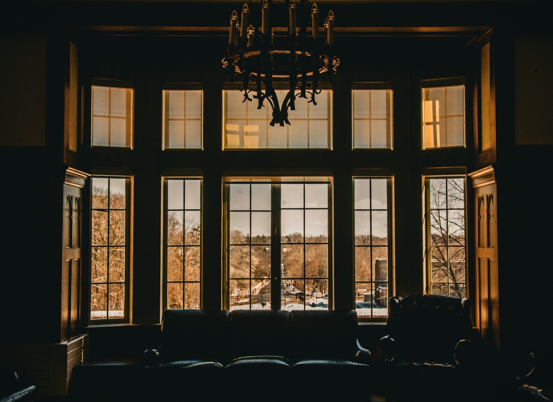 Tall paned windows in a dark room