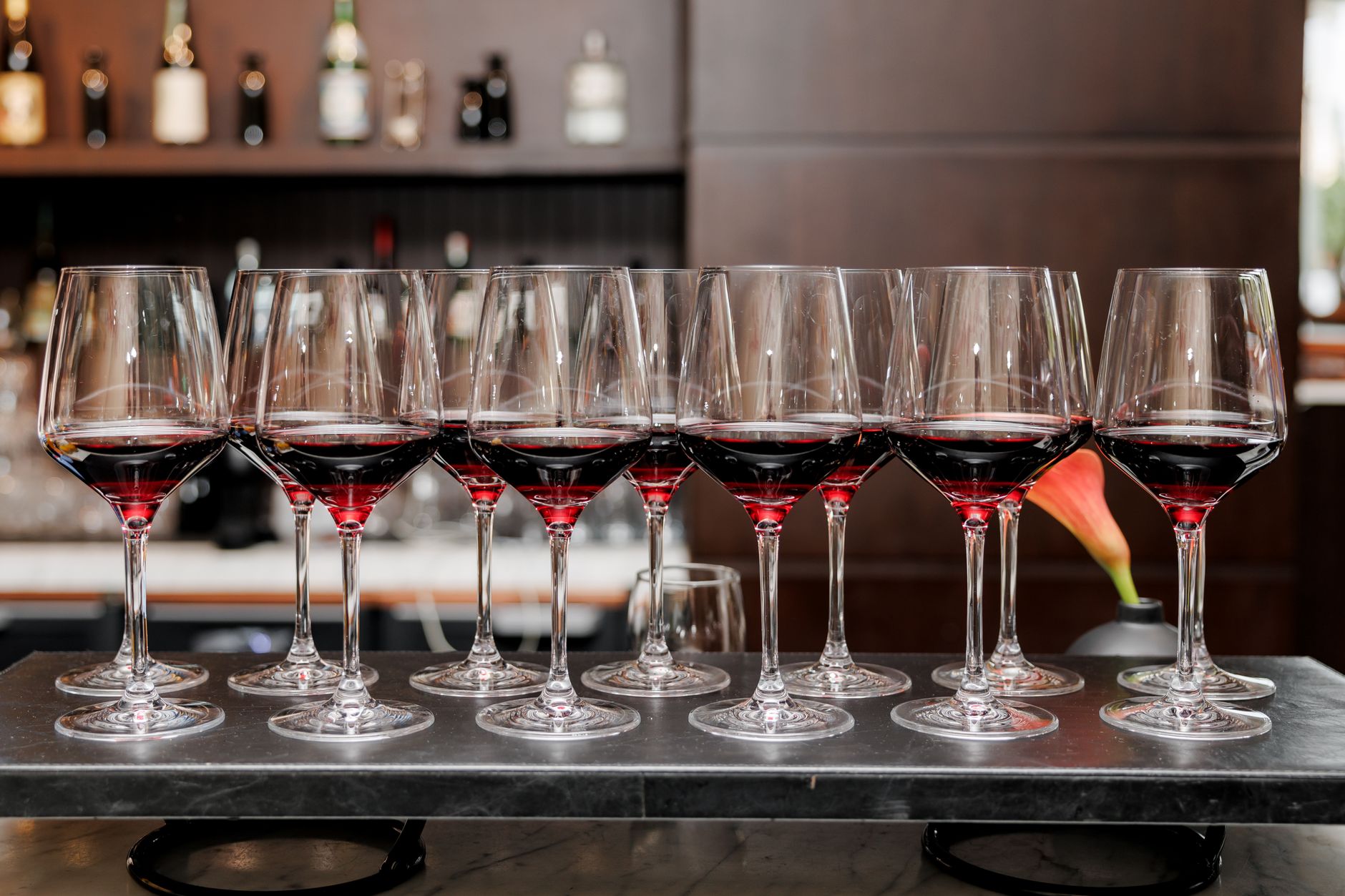 A glass of red wine on a table