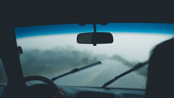 Best wiper blades: a windshield wiper clearing rain from a car windshield