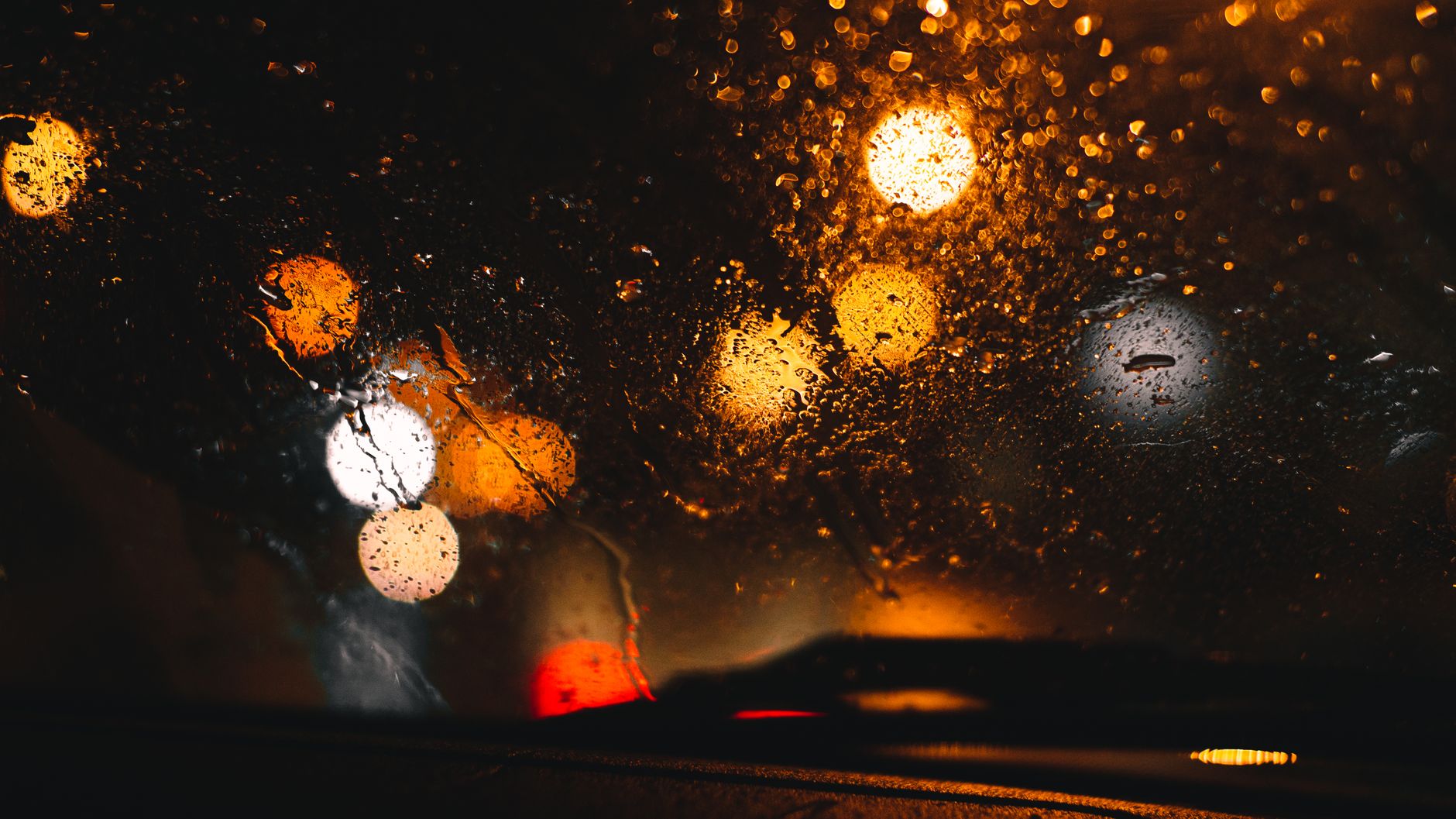 Raindrops on a car windshield