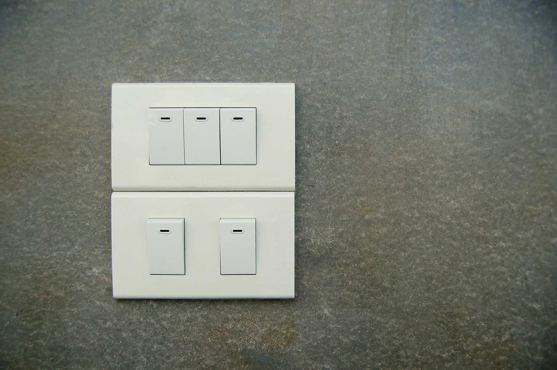 A light switch on a home wall