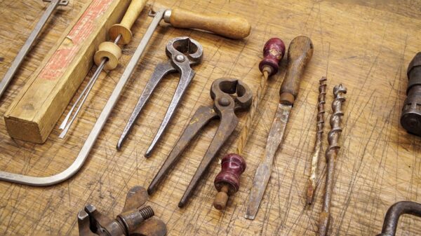 Old hand tools on a wooden bench